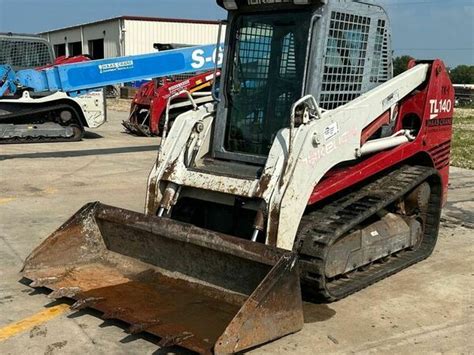 used takeuchi skid steer